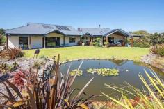  293 Stevens Rd Witchcliffe WA 6286 $1,595,000 Luxurious Estate 4 3 16 15 acre (approx) This magnificent homestead is set on 14 acres of undulating parkland right in the heart of the Margaret River wine region.  The custom designed home makes the most of the north facing aspect and has been thoughtfully planned to make best use of its solar passive aspect. Designed in two living wings with a connecting foyer, the enormous open plan living/kitchen/dining wing comprises a modern well appointed kitchen, expansive sandstone tiled flooring and view capturing doors which open onto the large covered outdoor deck that soaks in the tranquil atmosphere of the landscaped gardens complete with lily pond. Conduct business from home with ease as there is a separate study located adjacent to the entrance door. The bedroom wing is cleverly designed with three double size bedrooms surrounding a second loungeroom that also overlooks the gardens and opens directly onto the north facing verandah. The main bedroom has the indulgence of a walk through robe that leads into a sumptuous ensuite. A second bathroom and separate WC (complete with exterior vanity) is located closer to the remaining bedrooms. Modern stylish tiling, carpeting and fixtures and fittings are evident throughout the entire home and provide a sense of luxury and comfort. If this luxurious home isn't enough for the family, there is a modest cottage located in the valley of the property. Nestled amongst trees, this accommodation would be the ideal pad for the teenager or extended family or rent out to paying tenants, as it consists of a bedroom, open plan living and a bathroom. A spacious elevated deck leading out from the living area overlooks lush lawns and a picturesque spring fed 50m x 40m x 3m deep dam. A large 17.5m x 7.5m powered colourbond shed with concrete floor to two bays is situated between the main house and cottage and provides ample space to store all of the equipment. An area of this shed has been decked out into a games room/living quarters, providing even more space for the kids and extended family. Abutting Leeuwin Estate and neighbouring Voyager Estate wineries, only 9 kilometres from the Margaret River townsite and only 6 kilometres from the coast, live in luxury on the land knowing that the conveniences of town are only a short drive away and the beauty of the region is all at your doorstep. 