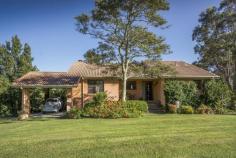  19 Lake Conjola Entrance Rd Yatte Yattah NSW 2539 Offers above $1.99m Inspired by the farmhouses & countryside of Tuscany, this enticing residence on 5 acres is just 7 minutes from Milton, Lake Conjola & beaches. Embrace the life-style & ambiance of this gorgeous home nestled on the side of a hill with open views over green hills & surrounded by olive & fruit trees. Relax on the sun-drenched deck, inhaling the fresh jasmine scented air or indulge your gourmet side in the farmhouse kitchen, which is a cooks delight or tinker to your hearts content in the expansive workshop and garage. The renovated weatherboard cottage at the rear of the property is a delightful retreat for guests or could easily become an artists studio or B&B. The features of this unique property are too long to list - enjoy the VIDEO via the VIRTUAL TOUR link, http://vimeo.com/122180508 then organise an inspection and be captivated !! Property ID: 1P0492 Property Type: House Land Size: 2.254 hectares approx. Building Size: 227 m² Garage: 2 Carport: 1 Construction: Brick & Tile Aspect: East West Features: Heating Area Views Built-In Wardrobes Open Fire Place 