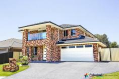 14 Pandorea Street Claremont Meadows NSW 2747 $899,990 OPEN HOME: Saturday 9th January 11:00am - 11:30am House - Property ID: 832257 Very Impressive Located in a new estate and surrounded by quality homes stands this meticulously presented huge family home with outstanding quality inclusions and more than ample room space. Double door entry leads you into a wide hallway with carpet formal lounge are * Open plan dining & family area * Polyurethane kitchen * 20mm granite bench tops * 900mm appliances  * Stainless steel range hood, a kitchen built for any master chef * Rumpus room with combustion fireplace for the cosy family get together * Downstairs toilet and vanity  * 5 double size bedrooms * Combination of walk in and built in robes * Large ensuite to main bedroom * Frame less shower screens * Double corner spa  * Main upstairs bathroom has double vanity & separate toilet * Wide upstairs hallway * Access to balcony with scenic mountain views * Zoned 10hp ducted air conditioning * Sound proof glass to southern facing windows * Manicured gardens * Double garage with one side drive through access * Extensive retainer wall construction * Alfresco dining * Garden shed * Double driveway Call Professionals Outer Western Sydney to find out more today.....  Print Brochure Video Email Alerts Features  Land Size Approx. - 569 m2 