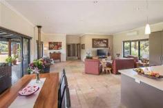  293 Stevens Rd Witchcliffe WA 6286 $1,595,000 Luxurious Estate 4 3 16 15 acre (approx) This magnificent homestead is set on 14 acres of undulating parkland right in the heart of the Margaret River wine region.  The custom designed home makes the most of the north facing aspect and has been thoughtfully planned to make best use of its solar passive aspect. Designed in two living wings with a connecting foyer, the enormous open plan living/kitchen/dining wing comprises a modern well appointed kitchen, expansive sandstone tiled flooring and view capturing doors which open onto the large covered outdoor deck that soaks in the tranquil atmosphere of the landscaped gardens complete with lily pond. Conduct business from home with ease as there is a separate study located adjacent to the entrance door. The bedroom wing is cleverly designed with three double size bedrooms surrounding a second loungeroom that also overlooks the gardens and opens directly onto the north facing verandah. The main bedroom has the indulgence of a walk through robe that leads into a sumptuous ensuite. A second bathroom and separate WC (complete with exterior vanity) is located closer to the remaining bedrooms. Modern stylish tiling, carpeting and fixtures and fittings are evident throughout the entire home and provide a sense of luxury and comfort. If this luxurious home isn't enough for the family, there is a modest cottage located in the valley of the property. Nestled amongst trees, this accommodation would be the ideal pad for the teenager or extended family or rent out to paying tenants, as it consists of a bedroom, open plan living and a bathroom. A spacious elevated deck leading out from the living area overlooks lush lawns and a picturesque spring fed 50m x 40m x 3m deep dam. A large 17.5m x 7.5m powered colourbond shed with concrete floor to two bays is situated between the main house and cottage and provides ample space to store all of the equipment. An area of this shed has been decked out into a games room/living quarters, providing even more space for the kids and extended family. Abutting Leeuwin Estate and neighbouring Voyager Estate wineries, only 9 kilometres from the Margaret River townsite and only 6 kilometres from the coast, live in luxury on the land knowing that the conveniences of town are only a short drive away and the beauty of the region is all at your doorstep. 