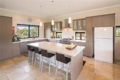  293 Stevens Rd Witchcliffe WA 6286 $1,595,000 Luxurious Estate 4 3 16 15 acre (approx) This magnificent homestead is set on 14 acres of undulating parkland right in the heart of the Margaret River wine region.  The custom designed home makes the most of the north facing aspect and has been thoughtfully planned to make best use of its solar passive aspect. Designed in two living wings with a connecting foyer, the enormous open plan living/kitchen/dining wing comprises a modern well appointed kitchen, expansive sandstone tiled flooring and view capturing doors which open onto the large covered outdoor deck that soaks in the tranquil atmosphere of the landscaped gardens complete with lily pond. Conduct business from home with ease as there is a separate study located adjacent to the entrance door. The bedroom wing is cleverly designed with three double size bedrooms surrounding a second loungeroom that also overlooks the gardens and opens directly onto the north facing verandah. The main bedroom has the indulgence of a walk through robe that leads into a sumptuous ensuite. A second bathroom and separate WC (complete with exterior vanity) is located closer to the remaining bedrooms. Modern stylish tiling, carpeting and fixtures and fittings are evident throughout the entire home and provide a sense of luxury and comfort. If this luxurious home isn't enough for the family, there is a modest cottage located in the valley of the property. Nestled amongst trees, this accommodation would be the ideal pad for the teenager or extended family or rent out to paying tenants, as it consists of a bedroom, open plan living and a bathroom. A spacious elevated deck leading out from the living area overlooks lush lawns and a picturesque spring fed 50m x 40m x 3m deep dam. A large 17.5m x 7.5m powered colourbond shed with concrete floor to two bays is situated between the main house and cottage and provides ample space to store all of the equipment. An area of this shed has been decked out into a games room/living quarters, providing even more space for the kids and extended family. Abutting Leeuwin Estate and neighbouring Voyager Estate wineries, only 9 kilometres from the Margaret River townsite and only 6 kilometres from the coast, live in luxury on the land knowing that the conveniences of town are only a short drive away and the beauty of the region is all at your doorstep. 
