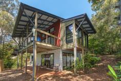  51 Knoll Road Tamborine Mountain QLD 4272  $625,000 Designed by the same talented architects behind the well-known 'Binna Burra Lodge', this home is one of the most private homes on the mountain! Sitting at a perfect N/NE aspect, and with a variety of living options to choose from, the opportunities for further growth and personalisation are endless. Combine this with the fact that the mountain is now home to over 1 million tourists each year, and you have the exact recipe for lifestyle and success.  Built by 'Ludwig', again on the most sought-after builders in the Hinterland area, only the highest quality materials have been used in construction. Features include: - Good size bedrooms spread over split levels - Open plan living with plenty of natural light and views of the natural surroundings - Fireplace in lounge/family area - Kitchen with plenty of bench space, island bench and lots of storage - Modern bathrooms with chic finishes - Opportunity for teenage retreat, granny flat, business from home With National Parks situated on both your Northern and Southern boundaries, and connecting rainforest gardens already established on the property, there is no better privacy or seclusion required, to create your own private oasis and take in the magical atmosphere offered by mountain living. With plenty of extra land still available and ideally suited to a pool, terraces or entertainment areas for guests, bring your builder and start dreaming of options to personalise this home and make it your very own creation.  Inspections welcome by appointment. Disclaimer: We have in preparing this information used our best endeavours to ensure that the information contained herein is true and accurate, but accept no responsibility and disclaim all liability in respect of any errors, omissions, inaccuracies or misstatements. Features Deck Fenced Undercover outdoor area   	 Outdoor entertainment area Balcony Smoke Alarms Property Details Bedrooms 		 3 Bathrooms 		 2 Off Street Parking 		 2 Land Area 		 1186 m2 