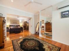  44 Daldawa Terrace Lyons NT 0810 $950,000 This magnificent executive residence situated in the sought after suburb of Lyons will surpass all your expectations if you are after a large family home that offers the finest in quality and ingenuity of design and functionality. When you pull up in front you will be impressed however when you step inside you will be awestruck. This elevated four bedroom, three bathroom tropical residence is the complete package. Not surprisingly It has won multiple accolades - (2011 HIA Winner Custom Built House; 2011 HIA Tropical Home; 2011 Master Builders Association Winner Individual Contract Home of the Year). As you walk in the front door and make your way up the extra wide staircase featuring Kwila treads imported from Indonesia with Zenolite risers you will be amazed at the vast living area. The generous yet separate living and dining areas feature highly polished Tasmanian Oak floors and flow seamlessly into each other. The striking 2-pac kitchen boasts an abundance of storage space, soft close drawers, granite bench tops, gas cooking, stainless steel splash back, quality appliances and provides easy access to the expansive rear balcony. You will want to spend time here. When it comes to dining, you?re spoilt for choice. Your options include a huge, impressive rear deck which looks out over the neatly laid out, landscaped tropical back yard. The vista also encompasses the sparkling waters of a designer in ground pool, complete with spa and waterfall. The pool also lights up at night should you decide on an evening dip. Perhaps you?d prefer the front deck which provides ample space, cover and a leafy, green outlook courtesy of the tree lined boundary which camouflages the rear of RDH. A perfect place to relax and watch the sunset. At the end of a relaxing afternoon unwind further in your amazing master bedroom ? this has truly been escalated to a totally different level. It is easily described as immense and includes such comforts as a generous built in robe as well as an ample walk in robe, split system A/C?s at either end. The bedrooms en suite is also in a class of its own, featuring a double wash basin set into a floating vanity, a huge shower recess with dual shower heads and taps, louvered windows for ventilation and room to move. The main bathroom is fitted with a nice sized corner tub for those times when you just want to sink into some bubbles and let the cares of the day drift away. This room is complimented also by the separate shower with slim line glass panel recess, the room boasts frosted louvers for ventilation. Additional benefits include a large approximately 4m x 5m rumpus room/5th bedroom downstairs as well as a downstairs tropical style bathroom ? prefect for a shower straight after a dip in the pool, an undercover entertainment area and storeroom and a beautiful tropical garden and enough private yard space for the children to play safely.  This home has High speed data connected through Telstra smart community as well as having NBN connected. This home epitomises the best of tropical living, complimented with the decadence of modern comforts in a sought after location - just a stone?s throw from Casuarina shopping Centre, Royal Darwin Hospital and the stunning Casuarina Coastal Reserve. These kinds of quality family homes are in demand, but not often found. Inspections Inspections by appointment only. Features General Features Property Type: House Bedrooms: 4 Bathrooms: 3 Indoor Ensuite: 1 Toilets: 3 Alarm System Floorboards Broadband Internet Available Built in Wardrobes Dishwasher Rumpus Room Split system Air Conditioning Outdoor Carport Spaces: 2 Balcony Outdoor Entertaining Area Swimming Pool - Inground Eco-friendly Solar Hot Water 