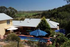  44 Tierney Lane Mudgee NSW 2850 $1,560,000 Wombadah Luxury Guest House The Offer On offer for sale is the freehold of a purpose-built guest house and its well-established Bed and Breakfast business. The sale is inclusive of the website, the business name and the furnishings of the four guest rooms along with some custom made main house inclusions. The Property The property is on a 9.4 hectares parcel of land located just outside the township of Mudgee in an area known as the golden triangle on account of its numerous family owned vineyards. The improvements consists of a two level guest house with a single carport, additional under-the-house garaging for 7 cars, an in-ground solar heated pool with a gas heated spa, a wine cellar and a store room. There are also two large water tanks that keep the property well supplied with water.  The house was built in 2004 and is designed to provide privacy to guests and owners with a separate guest accommodation wing that can be accessed directly from the garage area and through a pool side courtyard. The guest wing contains four luxuriously appointed and spacious guestrooms, all with King beds, a sitting area and ensuite bathrooms. Each of the tastefully decorated rooms has access to the North facing balcony that overlooks an olive grove and provides uninterrupted views of the Cudgegong valley below with its lush greenery and boutique wineries.  The main part of the house comprises of a large lounge area with a cosy fire place, an adjacent dining room, a reading room, a study, a laundry and a disabled friendly bathroom. A well designed and fully equipped kitchen with walk-in pantry is directly opposite the dining room where breakfast is served for up to 8 guests. Upstairs there is an owners retreat with a lounge room, a master bedroom with ensuite, spa bath and walk-in robe.  The Business The BnB business is well established with 11 years track record. It enjoys repeat business and a great reputation for high quality hosting. It is rated 4 ½ stars by Star Ratings Australia and is mainly focused on couples only. It is positioned as a luxury weekend retreat or short stay for couples looking for a romantic getaway or a unique experience with a minimum of two-night stays. The current owners have deliberately favoured week-end occupancy over mid-week in their business promotions to maintain their chosen lifestyle. Despite this, turnover is healthy at approx. $100k per annum. There is room for growth for new operators willing to target the mid-week trade.  The Location The charming country town of Mudgee is located just over 3.5 hours from Sydney and 4 hours from Newcastle. It has a dynamic and friendly community and a strong and diverse economic base. Whilst well known for its fine wine, it is also blessed with historic buildings, boutique shopping and sophisticated dining options. The region is a popular destination for tourists and receives more than 496,000 visitors each year that come to enjoy the delicious local wine and food and the many sporting, market and cultural events that occur throughout the year.  Agent’s Opinion: This spacious house sits on the side of the hill in a serene bush setting. The interior is bright and airy and well laid-out. There is a number of relaxing outdoor seating areas pool side and on the balcony with delightful valley views. The business is easy to run and offers a great lifestyle with substantial income relative to the investment. This opportunity would suit a couple looking to enjoy a more relaxed lifestyle without sacrificing income Price 	 $1,560,000 Title 	 Freehold State 	 NSW Region 	 Central NSW Suburb 	 Mudgee Postcode 	 2850 Property Type 	 Hosted Accommodation Operating Status 	 Going Concern 