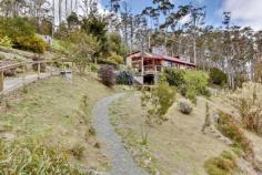  37 Kellys Rd Cradoc TAS 7109 $275,000 Perfectly Peculiar Property Entirely Unique 2 Bedroom Celery Top Home with separate Self-contained Chalet plus a shed / studio and all set on an idyllic 1.5 acre easy maintenance native bush block. The views from all 3 buildings are simply amazing across the Huon River valley towards the often snow-capped mountains of Tasmanias wilderness and world heritage area. Timber floors and decks and a covered pergola add to the country charm of this property. Watch the eagles soar whilst you live in absolute comfort and individual style in amongst the tree tops on this private property. Around 5 minutes drive to the artisan township of Cygnet or 10 minutes to Huonville and still under 40 minutes to the capital city Hobart.  The house has 2 comfortable bedrooms and a separate bathroom and laundry. The kitchen is open plan with the dining area and the lounge room has hidden spaces and built in timber shelving also. There is a small loft off the main bedroom and the timber decks and covered pergola offer excellent outdoor living. The Celery Top Pine Buildings have weathered with perfect character and blend effortlessly with the native surrounds.  The separate Celery Top Chalet consists of a large room with kitchenette and bulk storage cupboards and a separate bathroom with shower and toilet, the views from the full width front windows are also amazing and the large timber deck provides yet more outdoor entertaining space. Above the chalet sits the separate workshop which would make a perfect artists studio. The attention to detail and immaculate presentation make this a truly great purchase, so if you would like more information, an Ebrochure or to arrange an inspection then please call absolutely anytime at all, 7 days a week these unique properties are always the most popular. Property Details Type 	 Residential Sale Price 	 $275,000 Property Type 	 House Land Size 	 6093 m2 Building Size 	 83 m2 