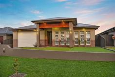  9 Gallinulla Place Glenmore Park NSW 2745 WHEN ONLY THE BEST WILL DO When you’ve seen the rest, come see the best! This one is sure to excite the most fastidious of home buyers, who are looking for quality, comfort & convenience, this beauty has the lot. And for those thinking of building, think again, this one’s better than brand new!  Appointed with only the finest of inclusions and loads & loads of extras, everything’s already been done so you just need to move in and enjoy. This privately built family home is only 4 years young and offers ample indoor & outdoor living space. A very functional floor plan design, consisting of 4 bedrooms, lounge, dining, family room, plus separate teenager’s retreat and study nook. As well as a superb gourmet kitchen, 2 luxury fully tiled bathrooms, an oversized double garage with loads of cabinetry for storage and a custom made panel lift door to accommodate a boat or those large “boys toys”. The living space flows out to a stunning alfresco area, where you can entertain in style with a fully functional built in gas BBQ and kitchen facility. The private backyard also features an impressive undercover Jacuzzi and fully landscaped gardens.  Set on an elevated block of 570m2, but no need for a lawn mower, maintenance has been made easy with quality synthetic lawn both front and back.  Located in popular Glenmore Ridge, in the estate’s only cul-de-sac, this tranquil setting also overlooks leafy parklands and is mere moments to Northern Rd access. 