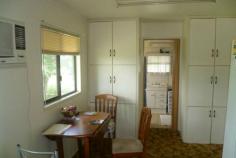  7 Causeway Rd Booyal QLD 4671 $159,000   File 4460 * 2 Bedroom & Computer/Office Room * Main Bedroom Ceiling Fan * 3 Airconditioners-Lounge, Computer Room & Kitchen (New) * Dining Room & Bathroom * Laundry Downstairs * Lawn Locker & 2 Caravans for Storage * 3 Rain Water Tanks & 700 g/h Bore Water * 1012m2 Allotment * Located at Booyal * Surrounded by Cane Fields/Dam Features Smoke Alarms   	 Safety Switch Property Details Bedrooms 		 2 Bathrooms 		 1 Secure Parking 		 1 Land Area 		 1012 m2 