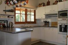  6 Penola St Bundanoon NSW 2578 $649,000 Sitting pretty in Penola This property has it all, character, outlook and space, master suite has its own wing whilst the open plan living looks out to the countryside beyond. The L-shaped home ensures a view from every window. Ducted reverse cycle heating and s/c wood fire Timber floors + 9 ft ceilings Open plan lounge, dining overlooking rear deck Double garage with storage attached by covered walkway Main bedroom with walk in robe, accesses verandah Electric cooking in kitchen with breakfast bar  An easy care block with minimal gardens and some good stands of trees. The deck wraps around the back of the house and is the perfect place to sit, relax and watch the wild life go by... Property: 	 House Bedrooms: 	 4 Bathrooms: 	 2 Parking: 	 2 Land Size: 	 2644 Sqm Council: 	 Wingecarribee 