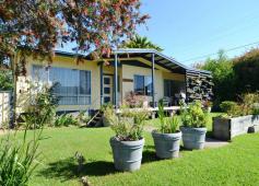  2 Linton St Eden NSW 2551 $265000 This nicely presented 3 bedroom home is the perfect ticket for the first home buyer or investor. A sunny north facing verandah, landscaped gardens and established trees gives it oodles of street appeal. The lounge room is warm and inviting with its wood heater, red feature wall and polished timber floors that flow through to the dining room and a new kitchen with gas cooktop and dishwasher. The bedrooms are all generous in size and the bathroom, laundry and separate toilet are all well maintained. The level fenced backyard is a treat for outdoor entertaining or a big trampoline for the kids. The detached carport has additional storage shed at the rear plus there's a beaut garden shed. Ideally positioned close a general store, Eden Golf Club and the nearby Lake Curalo boardwalk which takes you on a relaxing walk via the sporting fields to Aslings Beach. This delightful home is a great opportunity, explore it today! FencedVerandahElectric stoveRange hoodDishwasherElectric hot water system Bedrooms 		 3 Bathrooms 		 1 Car Ports 		 1 