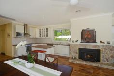  10 Elmswood Ct Bundanoon NSW 2578 $1,589,000 Bundanoon Lodge The Offer On offer for sale is the freehold of a purpose-built guest lodge and its well-established Bed and Breakfast business. The sale is inclusive of forward bookings, the website, the business name and the furnishings of the five themed guest rooms along with some of the main house content.  The Property The property is located a short distance from the centre of the beautiful Southern Highlands village of Bundanoon, known as the northern gateway to Morton National Park. The improvements consist of a two-level guest lodge with an attractive porte-cochere, extensive covered balconies and outdoor decking and a stand- alone 3 roller-door garage/workshop of substantial size, all on manicured grounds of approx. 1.5 acres (6242 sq. m) that are accessed via a charming tree-lined long driveway. The house benefited from major renovations and upgrades since 2011 and is now in excellent condition internally and externally with ducted heating throughout. It is designed to provide privacy to guests and owners with a separate guest accommodation wing that is accessed from an impressive and welcoming entry foyer with a large stone fire place and a library. The guest wing comprises of five themed and spacious guestrooms, all with kitchenette and ensuite bathrooms (two with spa baths). Each of the tastefully decorated rooms has direct access to the East facing balcony that overlooks the front garden. The covered balcony provides the guests private access to their comfortable guestroom as well as a very pleasant outdoor seating area. The rooms are well equipped with flat screen TVs, DVDs and CD players, microwave, mini-fridges and sitting areas.  The main part of the house comprises of a large lounge area with a cosy fire place and a dining area that opens up to covered outdoor decking, a bright and airy rumpus room, and an open plan modern kitchen with adjacent breakfast area that opens up to a delightful outside patio. There is also a sizable study/office, a nice bathroom, a laundry and a small size bedroom with backyard access (currently used for family guests).  Upstairs there is an owners or manager’s private retreat with a spacious lounge room, a modern bathroom, an open plan kitchen and dining with family living and a big master bedroom with ensuite and walk-in robe. There is access from every room to a long balcony that provides wonderful views of the surrounding areas and a lovely spot for morning or afternoon tea with family and friends (the human or feathered kind). There are plenty of storage cupboards throughout the house and ample attic storage.  Note that the property is connected to town water, sewerage and gas and has good internet reception. The Business Bundanoon Lodge enjoys repeat business and a great reputation for high quality accommodation. It won a number of awards including the best property in the Southern Highland from TriVaGo in 2014 and a multitude of Certificates of Excellence from TripAdvisor. It is currently in the number one position for BnBs in Bundanoon based on overwhelmingly excellent reviews from past guests across the web. The lodge is rated 4 stars and is currently positioned as a comfortable, well-appointed and pet-friendly lodge with parking, Wi-Fi and breakfast included in the nightly rate (we note however that the rooms are self-contained). The available guest-rooms cater for couples, small families or groups of friends with the availability of various bedding configuration options in most rooms allowing up to 25 guests at any one time. Nightly rates for two guests range from $125-$170 mid-week to $190-$250 on weekends producing a healthy turnover in FY 2014/2015 of approx. $132k per annum ex GST.  The Location The charming country village of Bundanoon is situated in the Southern Highlands about half way between Sydney and Canberra and about an hour from Wollongong. It is an easy drive (under 1.5 hrs) south from Sydney on the Hume Highway (F5), just past Bowral and Mittagong near the villages of Sutton Forrest and Exeter. It is also located on the main south train line connecting Bundanoon with Moss Vale, Campbelltown and Sydney Central as well as Goulburn, Canberra and Griffith.  Bundy, as it is called by the locals, has retained its old world charm and connection with the natural beauty of the surrounding national park. Popular since the 1920s as a tourist destination, the village has fine old guesthouses, an excellent health retreat, cafes and antique dealers. It also has an active community and popular annual events such as Brigadoon, the Scottish themed event that attracts more than 10,000 visitors every April, the Bundanoon Garden Ramble held in October and the CamelBak Highland Fling, Australia’s largest mountain biking event.  The village sits at the edge of the great Morton National Park, one of NSW’s largest parks (162,000 ha). The park is a year round drawcard and features rugged sandstone cliffs; sandstone grottos (including the famous Glow-Worm Glen) deep, well-forested valleys; impressive waterfalls and several rivers. There are over 14 different walks for all levels, from easy to very challenging, and numerous cycling routes for visitors to enjoy fresh air, a diversity of flora and fauna and abundant wildlife.  The local amenities include five clubs, a post office, a swimming pool and 4 churches of different denominations. There are also 9 parks, a primary school, a chemist, a medical centre, a news agency and several shops and cafes.  Agent’s Opinion: Starting with a tree-lined driveway, this lodge is impressive. It is located in a quiet area close to town and the train station, in a lush garden environment with mature trees that display a wonderful rainbow of colours throughout the seasons. The attractive house has a perfect aspect with sunlight bathing the spacious rooms across the day. The interior is contemporary and well laid-out. There is a number of relaxing outdoor seating areas with surrounding views completing the experience of bliss and comfort. The BnB business is well established with 5 years of successful track record. It is easy to run and offers a great lifestyle with substantial income. Whilst the occupancy rate is healthy in the range of 40% to 50% per annum, there is room for growth with additional marketing initiatives that include more savvy online strategies.  This great opportunity would suit a couple looking to enjoy a more relaxed country lifestyle in a friendly community located in a safe and beautiful environment, a short and easy drive from major towns and cities without sacrificing income. Price 	 $1,589,000 Title 	 Freehold State 	 NSW Region 	 Sydney Suburb 	 Bundanoon Postcode 	 2578 Property Type 	 Hosted Accommodation Operating Status 	 Going Concern 