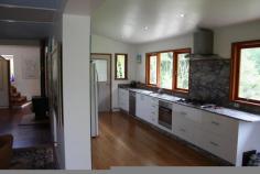  77 Geles Rd Upper Burringbar NSW 2483 $950,000 RURAL WONDERLAND House - Property ID: 796416 A lovely large, modern and fresh open plan 4 bedroom home on a cleared and levelled plateau. The home has been designed to have a flow through effect bring the outdoors in and captures the beautiful valley and hinterland views and inspiring sunsets to the west from most rooms in the home.  With a brand new kitchen that would make any cook happy and be at their creative best. A separate self-contained cottage/cabin for guests or teenagers retreat, located on the lower level of the property. When it is time to relax an outside spa bath helps to relieve even the most tired of souls. The property is framed by strands of hardwood timbers and has cleared pastures within the private 30 acres.  A natural spring water supply plus rainwater tanks and 100 mature avocados and 100 mature mangos with road systems in for easy harvest .  Burringbar Store, Sports Centre and Public and Primary School 5 minutes away and Beach 15 minutes, 30 minutes to Coolangatta Airport and Byron Bay 25 minutes.   Print Brochure Video Email Alerts Features  Land Size Approx. - 12 hectares 