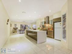  48 Parkview Dr Springfield Lakes QLD 4300 $599,000 Je ne sais quoiDesigned and built by BMW Homes in 2012, this HIA Award winning home would be an absolute delight to come home to. Used as BMW's display home for Springfield Lakes, this property has been finished superbly with top quality fixtures and materials throughout. Its elevated living allows expansive views, including views of the lakes.  Cafes, Restaurants, Orion Shopping Centre, Robelle Domain Parklands, Orion Lagoon and Springfield Central Train Station are all just minutes away.  Visitors will be welcomed along a sandstone path through landscaped native gardens up to the spectacular entrance of the home. Upon entering you will immediately feel at ease as the clever use of wood, glass, steel and natural light creates a wonderful ambience and feeling of warmth.  The clever design allows for open plan living yet provides distinct areas for both formal and informal living. The kitchen is the real focal point of this spectacular home positioned perfectly to allow interaction with guests and family, no matter the occasion. With Caesar stone bench tops and Polytec cabinets complete with dishwasher as well as an extra-large oven, gas top burner, glass range hood and a huge Butler's Pantry with loads of shelving and bench space.  Be spoilt for choice when entertaining or simply enjoying an afternoon glass of wine with two entertaining areas. There is a great sized tiled balcony off the main living area with lake views plus a second private entertaining area out the back, with Beachwood decking. The Master Suite is just like the rest of the home; spectacular. The bedroom will accommodate a King-size bed still leaving room for side tables. The room has ducted air-conditioning as well as a ceiling fan. The Walk-in-Robe has the added benefit of shelving already installed. The ensuite is all class with his/her showerheads as well as his/her vanity.  The remaining three bedrooms have built-in robes, ceiling fans and ducted air-conditioning and are generous in size easily accommodating Queen beds. Securing this house would be securing a wonderful lifestyle. At a Glance: 4 Bedrooms  2 Bathrooms inc. Ensuite  Open Plan Living Amazing Kitchen with all the mod cons and large Butler's Pantry 2 Outdoor Entertaining Areas Zoned Ducted Air Conditioning Solar Panels Alarm  Location Location   