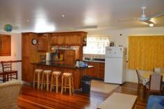  90 Kingfisher Parade Toogoom QLD 4655 $695,000 "BEACHSIDE" Located on the beachfront in a fabulous location this home has it all. With quality finishes and stunning ocean views. Designed for minimum maintenance, with high ceilings and a separate full self-contained parents retreat it sports: * Leadlight windows, rosewood floors and feature walls, large and open living & lounge areas with recessed storage areas. * 4 Large bedrooms, main bedroom with ocean views, separate parents retreat (kitchenette, ensuite and dressing room). All bedrooms have ceiling height built-ins and ceiling fans * Hugh bathroom with shower and spa bath, separate toilet * Modern rosewood and stainless steel kitchen with views to the beach * Large covered outdoor entertainment area with BBQ and fully screened. This home has been especially designed for beachside living and outside boasts low maintenance features, with sandstone base, and weather-side walls to no maintenance weatherboard cladding and soffit linings. Wide green lawns and cosy secluded landscaped gardens ensure that no matter what time of day there is always somewhere to enjoy. The outside also boasts a beachside shower in its own private alcove and close by change room and laundry.  There is a full length carport long enough to house car and boat, plus a large lock-up boat garage with 3m high roller doors. There is also under house storage areas with wide lockable doors. Other features: Built-In Wardrobes,Secure Parking,Polished Timber Floor,Terrace/Balcony Property Details Elders Property ID: 9101338 4 bedrooms 2 bathrooms 2 car parks Land Area 600 square metres Single garage Single carport 