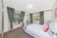  12 Brazel St Higgins ACT 2615 A Little Piece of Paradise Bordering parkland in one of the nicest positions in the suburb, this gorgeous family home offers a perfect sanctuary to come home to, put your feet up and really relax.  There is ample formal and informal living space with a flexible, versatile floorplan that will suit a number of uses. The sunken lounge room has high ceilings and a cozy Cheminee Philippe fireplace, and the additional family room is ideal to provide a living space for children or could be used as an oversized formal dining room that will accommodate extended family and friends.  All three bedrooms are ample in size and have their own split system air conditioning and built in wardrobes, the main bathroom has been stylishly renovated with floor to ceiling tiling and double shower including rain showerhead, there is ducted gas heating, carpets are brand new and even the paintwork has been freshened up. Throughout there is a clever use of glass to take advantage of northerly sunshine and the stunning green landscape, and bi-fold French doors open up the family room to the private alfresco, creating the perfect entertaining area.  Outdoors, the backyard is a gardener’s paradise with stunning established plants and shrubs creating the perfect tranquil setting and there is plenty of storage space, a chicken coop and even your very own glass house.  Set in a fantastic quiet street with parkland beside and with easy access to buses, schools, local shops, thriving Kippax fair and Belconnen Town Centre, this impressive family home could be just what you’ve been waiting for. EER 1.5 Features include:  • 	 Three ample bedrooms with split system air conditioning, built in wardrobes and two with bay windows • 	 Sunken lounge room with high raked ceilings • 	 Large family room with bi-fold French doors leading out to the entertaining area • 	 Near new stylishly renovated bathroom with dual shower, including rain shower • 	 Cupboard filled kitchen with plenty of space • 	 Ducted gas heating plus a cosy log fire to create the perfect ambience throughout winter • 	 Fresh paintwork and new carpets • 	 Roller shutters for security and privacy • 	 Leafy, private outdoor entertaining areas surrounded by stunning established trees and shrubs • 	 Double garage with remote door and access to the back yard • 	 Plenty of extra storage sheds outside, chicken coop and glass house • 	 Formal and informal living areas including a large family room • 	 Large covered entertaining deck • 	 Fantastic position beside parkland and within easy reach of buses, schools, local shopping, Kippax Fair and the Belconnen Town Centre   Property Snapshot  Property Type: House House Size: 147.00 m2 Land Area: 774 m2 Features: EER: 1.5 
