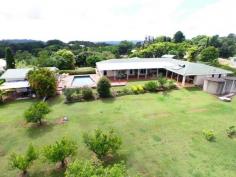  41 Kiel Mountain Rd Woombye QLD 4559 THIS LARGE DUAL LIVING WOOMBYE WINNER ON ACREAGE HAS EVERYTHING RIGHT ON THE DOORSTEP - YOUR PERFECT SC HINTERLAND FAMILY BASE AWAITS! Occupying an elevated breezy position just four minutes from Woombye village, this home offers an enormous range of options for the large or extended family, promising the perfect balance of indoor & outdoor hinterland living. - 1.9 acres with north-west views to Blackall Range - Adjoined yet separate dual living on one level - 5 bedrooms with built-in robes - 3 bathrooms, 2 with separate toilets, 1 ensuite - Study/ Office - 2 Lounges, 1 with combined dining - 1 Formal dining room  - 2 Kitchens, with breakfast areas and electric appliances - Solar and electric hot water - Air-conditioning  - Fans in all rooms - Undercover BBQ / entertaining area - Gardens - Numerous established fruit trees - Garaging for 3 vehicles, extra high double Carport, RV/ Caravan parking - Workshop/ Garage, Shed - Town water, Tank Water 2 x 10,000 ltr, 1 x 7,000 ltr plus Bore for watering gardens - Inground Swimming Pool - Shared, private driveway Plus lots more Solidly built from brick under tile roof with an impressive entrance portico this single storey 1980's property on just under two acres is essentially two great homes in one.  The main wing provides three good sized bedrooms (main with ensuite) plus compact study, open plan lounge/dining, family kitchen, bathroom & laundry whilst the conjoined 'annexe' which can be separately accessed offers a full kitchen, two bedrooms, living room, bathroom & laundry. Both have direct access onto the wonderful rear covered patio - the perfect venue for entertaining in all weathers and with beautiful far-reaching north-west views towards Blackall Range.  Adjacent are a fenced north facing pool and detached large shed which back on to the larger part of the land, planted predominantly with a good number of mature citrus trees (mandarin, orange & lime) plus avocado, mangos and olives. Aside from integral double garaging to the front of the house there's a separate covered RV/caravan parking area with hard standing, a good sized lawn and low maintenance beds with easy care planting. Town supply, bore and tank storage ensure the home never runs short of water and allows selective switching if required for irrigation. In summary, this substantial property offers a fabulous opportunity to update or reconfigure the interior as required - or leave exactly as is - the choice is entirely yours.  The location could not be more convenient too - just 15 minutes to the coast, 15 minutes Blackall Range, 75 minutes Brisbane, 30 minutes Noosa, 20 minutes local airport plus a choice of rail stations and 6 excellent schools right on the doorstep! Very rarely does such a versatile quality home offering entirely separate extended family living come to market, so don't miss your chance.  Inspections by appointment, please phone Elaine Gentles on 0415 367 787 or Martin Fisher on 0415 356 170. Other features: Built-In Wardrobes,Close to Schools,Close to Shops,Close to Transport,Garden Property Details Elders Property ID: 9261247   5 bedrooms 3 bathrooms 7 car parks Land Area 7809 square metres Car Parks: 2 3 car garage Double carport Swimming Pool Air Conditioning 
