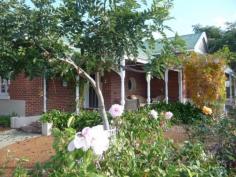  161 Avon Terrace York WA 6302 $525,000 Circa 1920 Colonial Beauty This beautifully presented circa 1920 colonial brick & iron home offers three large bedrooms, formal sitting room and superb new open plan kitchen/dining with granite bench tops, polished floors, high ceilings, reverse cycle ducted air cond, ceiling fans and double oven.  The property is complete with large North facing patio, outdoor spa, solar HWS, double lockup garage and double carport, 2x2500gal rainwater tanks all on a 1072m2 block in central town location. This property is well worth inspection. Property Details Elders Property ID: 8319128 3 bedrooms 1 bathrooms 4 car parks Land Area 1072 square metres Double garage Double carport 
