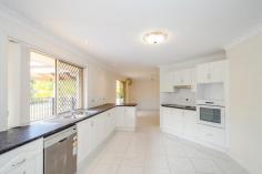 13 Carthurbie Ct New Auckland QLD 4680 $650,000 CLEVER DESIGN FOR A LARGE FAMILY! Situated in the very popular suburb of Parksville & set on a large 3303m2 flat block with its very own creek! This home is big enough for the largest of families!  The central spacious kitchen is perfectly nestled between the air-conditioned family room and separate dining room and looks out over the in-ground pool so you can keep an eye on the kids while you prepare dinner. Cleverly designed, the formal lounge and the air-conditioned main bedroom with its lovely ensuite and walk-in robe are situated at one end of this long ranch style home while the other 4 bedrooms, study/6th bedroom, main bathroom and air-conditioned rumpus room are at the other. The rumpus room is the 3rd living area and is an excellent kids play room or teenage retreat! The main bathroom has a powder room so the there is no fighting over the bathroom in the morning! Outside there is a large covered area plus a huge concrete pad for parking or extending the covered entertaining area. There is also a great in ground pool and large garden shed all surrounded by lovely landscaped gardens which includes your very own creek at the back of the block which actually runs when there has been really heavy rain!  This home is perfect for the large family and should not be missed at this price! Call Julie or Graeme today to inspect! Property Details Elders Property ID: 9346942 5 bedrooms 2 bathrooms Land Area 3303 square metres 