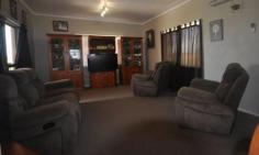  32 Burgamoo Road Helens Hill QLD 4850 $369,000 Substantial two storey 5 bed home on an acre of land just 10 minutes from town. Property ID: 7063956 This private, modern family home provides for the large or extended family. Upstairs offers 4 bedrooms (Three which open onto the full length verandah) plus study with open plan living and dining. A new kitchen with long island bench that offers extra storage space and comfortably seats four adults is the focal point of the house. The upstairs laundry boasts plenty of storage, room for extra fridges or freezers and is conveniently located next to the kitchen.  Downstairs has a separate living area ideal for extended family, teenagers or home office. Offering a large lounge area, modern bathroom and an extra bedroom with generous storage. A great place to entertain, this space has direct access to a very large, fully lockable garage which would accommodate two cars, four wheeler, ride on and camper trailer. If it is green living that you are after you will love the bore and large chook pen. To appreciate the features and abundance of space this rural property provides call for your private inspection. 
