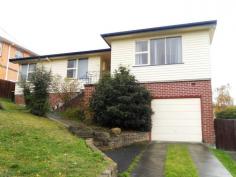  22 Chippendale St Claremont TAS 7011 $235,000 A Family Home with Plenty of Potential The first thing you will notice about this home when you come to view, is the space, the second thing to impress you will be the views!  Set high on its block to maximise the stunning river and Mt Wellington views, this large family home will attract a lot of attention. From the formal entry hall you move into the large living area with its own wood burner and reverse cycle air conditioner.  There is a large kitchen diner with plenty of room to entertain family and friends. The kitchen itself is quite modern with lots of storage and has large windows overlooking the back yard and beyond the River Derwent.  The dining space/family room runs off the kitchen and opens up onto a large sunny deck. This will become your go to place for sunny evenings with a cool drink and those views! There are three large bedrooms, the master with built-in robes, plus a modern family bathroom with separate shower and bath. The property also includes a separate area off the lounge which could be utilised as a study, family dining room or even a fourth bedroom. There is a single car garage under the house plus plenty of off street parking. The backyard is fully enclosed and features a large covered gazebo that would make a great party venue or a very special man cave. With plenty to offer the first home buyer or investor, this property will attract a lot of attention, so make sure you arrange a viewing as soon as possible.   Property Snapshot  Property Type: House Aspect Views: Mountain & Water Views Construction: Weatherboard House Size: 96.00 m2 Land Area: 635 m2 Features: Air conditioning Decking Dishwasher Distant Views Fenced Back Yard Fully Fenced Yard Lock-up Garage Undercover Entertainment Area Waterview 
