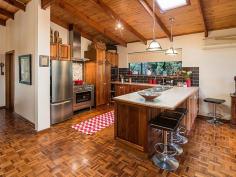  44 Bollen Rd Mt Barker SA 5251 $575,000-$610,000 Soul Inspiration! Property ID: 9494721 An inviting residence with a warm ambiance, architecturally designed with lofty raked ceilings and spacious living. One proud homeowner has lovingly created a homely environment, which also exudes style and taste. The rendered Tuscan-ranch style facade offers fantastic street appeal, with fully lit front verandah. The large English Oak provides excellent shade from the afternoon sun, and the double carport takes care of off-street parking.  You will certainly experience a “WOW” moment upon entering the home, as you cast your eyes over the parquetry flooring, and gaze past the family room to the sunny glass conservatory. The solid timber kitchen has been completely remodelled, now featuring new stainless steel oven with gas cook top, new dishwasher, pantry cupboards, freshly tiled splash and appliance hutch. Linking is the meals area, and there are handcrafted Western Red Cedar French doors leading outside to the private alfresco patio. The central family living is as cosy as a cow in cashmere, with new Masport slow combustion log fire, and fire surround featuring stunning travertine tiling. A highlight of the family area is the adjoining light and bright conservatory which could be utilised as a music room, creative area or home office. Featured again are three sets of quality Western Red Cedar French doors. The third living zone is the dining room located at the front of the residence, offering new pure wool carpet and double glazed windows. The main bedroom links with the conservatory, and offers ensuite bathroom and walk-in robe. There are three bedrooms, one of which is utilised as an office and has built-in robes. The main bathroom offers bath, shower and toilet; there is also a third toilet alongside the laundry. Experience the tropics in Mount Barker – take a splash! Or recline on your floating couch. Either way, you know that you will be the envy of your friends as you show off your in-ground pool with landscaped surrounds, including a paved undercover entertaining area and elevated timber viewing deck. Take a sip of your cocktail and smile. A great offering with a unique architecturally designed home, presented to please. Welcome home. Building / Floor Area 	 221 sqm Land Area 	 940.0 sqm 