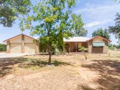  30 Dawson Dr Cowra NSW 2794 $335,000 Tidy Brick Home on 1 Acre, Close to Town Positioned on a low maintenance 4127m2 (1 acre) block, sits this well tidy brick veneer home. The current owners have loved and maintained this property for many years however the time has now come for them to move on, meaning a great opportunity awaits for an astute buyer to purchase in this sought after location.  This home consists of three double sized bedrooms all with celling fans and built in robes & the main bedroom also boasts a spacious walk in robe and ensuite. The kitchen dining and living are all functional and open plan with glass sliding doors leading out to the back verandah.  Other features include:  * Second shower and toilet in the laundry * Office or possible 4 bedroom conversion in the garage * Double garage with undercover access to the house * Additional single garage/workshop with power  * Ducted evaporative cooling & gas heating  Call Adam Gambrill today on image: chrome-extension://lifbcibllhkdhoafpjfnlhfpfgnpldfl/call_skype_logo.png0437 007 303 or email agambrill.cowra@ljh.con.au for more information or to arrange a viewing. Don't sit back and expect this property to last long call now.   Property Snapshot  Property Type: House Aspect Views: Easterly Aspect Construction: Brick Veneer Land Area: 4,127 m2 Features: Built-In-Robes Dining Area Ensuite Fenced Yard Storage Verandah 