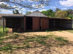  94 Rodd St Canowindra NSW 2804 $165,000 Home in Town on Half an Acre This three home is situated in a convenient position in town and is walking distance from shops, parks and schools. It sits on some 2023m2 square metres in area with an established stable, plus a side driveway that accesses the lock up garage and 2 carports. The lounge is oversized and boasts a slow combustion heater to warm you on those frosty nights. While there is ducted evaporative cooling throughout, for the warmer days. The kitchen is generous in its size and offers plenty of bench and cupboard space and could accommodate an additional breakfast table.  There is the opportunity to add your style or just move in and enjoy, the choice is yours. Perfect for the home buyer or some one who is looking to move into town keeping the feeling of space.   Property Snapshot  Property Type: House Construction: Brick Veneer Land Area: 2,023 m2 Features: Built-In-Robes Close to schools Close to Transport Fenced Yard Formal Lounge Garden Shed Town Sewer System Town Water Verandah 