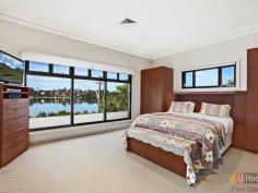  84 Henley Marine Dr Rodd Point NSW 2046 Luxurious Residence with Panoramic Bay and City Views Built to discerning standards, this landmark waterfront home has been crafted to take full advantage of panoramic views over Iron Cove and the city skyline. Designed by renowned architect Peter Lufi to mirror the curves of the bay, it combines a house-like layout with the convenience of apartment style living and features a flexible layout easily reconfigured for dual occupancy. Right on the doorstep of the Bay Run and Rodd Park, its grand interiors, high-end finishes and never-to-be-built-out views create a spectacular residence.  * Expansive upper level living bathed in northerly sun * Entertainer's custom granite kitchen, walk-in pantry * Deep terraces, Vergola, dazzling unobstructed views * 4 bedrooms with built-ins, Villeroy & Boch baths * Master with walk-in robe and large marble ensuite * Versatile lower level with 2 beds, living & courtyard * DLUG (internal access), storeroom, gated drive * Powder room, huge laundry, ducted air and vacuum * Exclusive waterfront setting, easy access to the CBD Inspections are strictly by appointment. All information contained therein is gathered from relevant third party sources. We cannot guarantee or give any warranty about the information provided. Interested parties must rely solely on their own enquiries.   Property Snapshot  Property Type: House Construction: Double Brick Features: Balcony Built-In-Robes Cable Television Close to schools Close to Transport Ensuite Internal Access via Garage Storage Study Undercover Entertainment Area Walk-In-Robes Waterview 