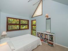  75-77 Tramican Street Point Lookout QLD 4183 $2,300,000 Both blocks are a total of 1,800m2 and have wonderful beach, bush and ocean views. The large architecturally designed house has a two car lock up garage at street level which links to the house with a timber walkway. The garage building has a large loft area - perfect for a craft room, office or even a separate studio bedroom and lockable storage areas underneath. The main house has two levels with all living areas on the top level.  There is a formal lounge area on entry, large open plan kitchen with walk in pantry plus formal dining - all opening onto a covered deck. There are two bedrooms and a bathroom on this level also.  The bottom level has three more bedrooms including the master bedroom with walk in robe and en suite bathroom, a second bedroom also has an en suite with spa bath and there is a small bunkroom The separate laundry with large storage area (perfect for a wine cellar) has direct access to the garden. 