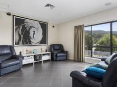  39 Snug Tiers Rd Snug TAS 7054 $599,000 If its space you're after, this property has it! This impressive double storey home has plenty of room for the entire family. Situated on a flat block (approx. 2378m2) where children and pets can safely play all day long. Park the caravan, boat, trailer and anything else… there is loads of room for everyone. Upon entering the home, the quality of the home is evident. All of the spacious bedrooms have built-in-robes and the master has walk-in-robes and an ensuite. The top level of the home has two great entertaining areas. One being the tasteful kitchen/dining/lounge area and adjacent is the family/theatre room that has its own projector screen and speaker system. There is even a great built-in bar. Also off the top level is an enormous suspended concrete deck with full length cover making it the ideal alfresco dining or party area. The house has nice views of the D'entrecasteaux Channel to Bruny Island also lovely views of Mount Wellington. The entire home has ducted air conditioning, regulating the temperature throughout the year. Ground level has a remote controlled double garage, big laundry and 2 multi-purpose utility rooms. A short stroll down the road has Snug Primary school, shops and services all well within your sights. So if it is space you're after, this modern, spacious home is well worth a look.   Property Snapshot  Property Type: House House Size: 306.58 m2 Land Area: 2,378 m2 Features: Airconditioning Built-In-Robes Dishwasher Ensuite Verandah Walk-In-Robes 