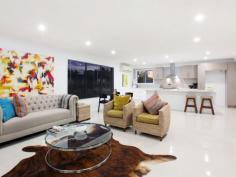  39 Mingaletta Dr Ashmore QLD 4214 $675,000 - $725,000 Seeking a Home with the Wow Factor? Look No Further! No expense has been spared in this amazing renovation, its the little extras that make the extraordinary difference in this gorgeous contemporary residence. Featuring an oversized grand timber door entrance flowing onto a custom built solid timber staircase that leads you into the large air conditioned open plan living area which incorporates indoor/outdoor living effortlessly. Houses of this calibre in this price range have been flying out the door so please don't delay as this beautiful abode will be no different! * Huge mastersuite with full length walk in robe and fully renovated ensuite * Oversized 4th bedroom with high raked ceilings (could be used as a second living area, children's retreat or home office) * Enormous chefs kitchen with stone benchtops, 2pac cupboards, gas cooktop and large breakfast bar * Beautiful second bathroom with freestanding bath, large shower.  * Powder room with direct access from outside to avoid water from the pool being walked through the house * Large undercover outdoor area with bar/servery overlooking the in-ground swimming pool * Lots of grassed areas for the children or pets throughout the large 790m2 allotment * Brand new colorbond roof with new insulation and warranty * Double lock up garage with new Pirie electric double door * New LED lighting and ceiling fans throughout 