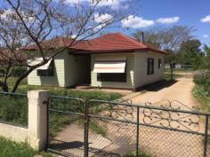  94 Rodd St Canowindra NSW 2804 $165,000 Home in Town on Half an Acre This three home is situated in a convenient position in town and is walking distance from shops, parks and schools. It sits on some 2023m2 square metres in area with an established stable, plus a side driveway that accesses the lock up garage and 2 carports. The lounge is oversized and boasts a slow combustion heater to warm you on those frosty nights. While there is ducted evaporative cooling throughout, for the warmer days. The kitchen is generous in its size and offers plenty of bench and cupboard space and could accommodate an additional breakfast table.  There is the opportunity to add your style or just move in and enjoy, the choice is yours. Perfect for the home buyer or some one who is looking to move into town keeping the feeling of space.   Property Snapshot  Property Type: House Construction: Brick Veneer Land Area: 2,023 m2 Features: Built-In-Robes Close to schools Close to Transport Fenced Yard Formal Lounge Garden Shed Town Sewer System Town Water Verandah 