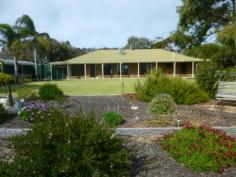  85 Narrung Rd Meningie SA 5264 $369,950 BEAUTIFLLY PRESENTED Property ID: 9547493 Positioned high on elevated allotment of approx 2.5 acres to take in the lake views, this lovely home has 3 bedrooms (master with ensuite & built-in robe) + study or 4th bedroom, timber kitchen with walk-in pantry, dining, family room, lounge with slow combustion wood heater, 3-way bathroom & laundry. Features of this property are ducted reverse cycle air-conditioning throughout, return verandah & covered entertainment area with fish pond & magnificent garden with fire pit in the centre. Outside is double carport, double & single garages, approx 10,000 gallons of rainwater storage & watering systems over the well established lawns & gardens. Land Area 	 2.5 acres 