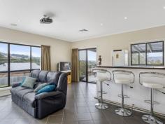  39 Snug Tiers Rd Snug TAS 7054 $599,000 If its space you're after, this property has it! This impressive double storey home has plenty of room for the entire family. Situated on a flat block (approx. 2378m2) where children and pets can safely play all day long. Park the caravan, boat, trailer and anything else… there is loads of room for everyone. Upon entering the home, the quality of the home is evident. All of the spacious bedrooms have built-in-robes and the master has walk-in-robes and an ensuite. The top level of the home has two great entertaining areas. One being the tasteful kitchen/dining/lounge area and adjacent is the family/theatre room that has its own projector screen and speaker system. There is even a great built-in bar. Also off the top level is an enormous suspended concrete deck with full length cover making it the ideal alfresco dining or party area. The house has nice views of the D'entrecasteaux Channel to Bruny Island also lovely views of Mount Wellington. The entire home has ducted air conditioning, regulating the temperature throughout the year. Ground level has a remote controlled double garage, big laundry and 2 multi-purpose utility rooms. A short stroll down the road has Snug Primary school, shops and services all well within your sights. So if it is space you're after, this modern, spacious home is well worth a look.   Property Snapshot  Property Type: House House Size: 306.58 m2 Land Area: 2,378 m2 Features: Airconditioning Built-In-Robes Dishwasher Ensuite Verandah Walk-In-Robes 