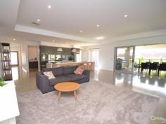  6 Durif Drive Moama NSW 2731 $695,000 Spacious Sophisticated Family Living Inspection Times: Sat 09/04/2016 09:30 AM to 10:30 AM Sun 10/04/2016 11:00 AM to 12:00 PM Situated on an approximate 1,000m2 allotment and less than 2 years old is this stunning five bedroom home. From the moment you open the front door you are graced with style and elegance.  The master bedroom includes a large walk in robe and ensuite with double vanity, waterfall shower and separate toilet.  The spacious spare bedrooms also have walk in robes and ceiling fans and the fifth bedroom located at the front of the home can be utilised as a home office with a hidden desk in the large built in robe.  The main bathroom features a bath and waterfall shower as well as a separate powder room.  The polished concrete floors feature hydronic floor heating and lead you through to the large open plan kitchen featuring a large breakfast bar with stone bench tops, stainless steel appliances including dual ovens and butlers pantry.  The open plan dining and living areas all feature floor to ceiling windows and push back glass sliding doors to the large undercover entertaining area with automatic blinds, open fire and ceiling fans and is surrounded by landscaped gardens which are equipped with a full automatic sprinkler system.  The home also features a large laundry, drying closest, plenty of additional storage space, ducted evaporative cooling and ducted vacuum.  The four car garage has been built to fit large boats, caravans and 4WDs and has a separate toilet.  If you have been searching for your dream home then look no further. PROPERTY DETAILS $695,000 ID: 363901 Land Area: 1000 m² Building Area: 30 