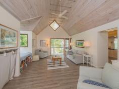  75-77 Tramican Street Point Lookout QLD 4183 $2,300,000 Both blocks are a total of 1,800m2 and have wonderful beach, bush and ocean views. The large architecturally designed house has a two car lock up garage at street level which links to the house with a timber walkway. The garage building has a large loft area - perfect for a craft room, office or even a separate studio bedroom and lockable storage areas underneath. The main house has two levels with all living areas on the top level.  There is a formal lounge area on entry, large open plan kitchen with walk in pantry plus formal dining - all opening onto a covered deck. There are two bedrooms and a bathroom on this level also.  The bottom level has three more bedrooms including the master bedroom with walk in robe and en suite bathroom, a second bedroom also has an en suite with spa bath and there is a small bunkroom The separate laundry with large storage area (perfect for a wine cellar) has direct access to the garden. 
