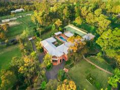  400 Wyong Rd Duffys Forest NSW 2084 Grand Fine Estate On 5 Acres It's rare that an opportunity of this scale is available in one of Duffy's Forest most prestigious address, minutes to premier schools, shops, golf courses, beaches and approx. 40mins drive to Barangaroo on Sydney Harbour and CBD. This is an extra special property in Upper North Shore's growing market complete with state-of-the-art equestrian facilities. " Malle Rose" presents an architect designed highly spacious full brick residence revealing luxury finishes and improvements, meticulously built by Pimas Gale. Enjoying a north aspect, be amazed by it's visually rich character and feel the moment you enter the resort like grounds. The use of large framed doors and glass windows throughout to cleverly create fluid, open, casual and formal living rooms offering multi-generational living. Combined with quality construction of concrete slab floors, cathedral ceilings in living areas, commercial steel ceiling frame, jarrah, spotted gum and hoop pine frames interiors - it is evident no expense was spared in creating the ultimate family home on this exceptional landholding.  Surrounding you an impressive array of flora and fauna with a blend of natives/tropical plants includes a Koi pond and level lawns, formal gardens ideal for large family events and corporate functions. The best of horse and walking trails fitting for an active growing sports minded or executive family. For the savvy investor, note two street frontages plus the setup of dwellings and paddocks potentially can bring you a healthy income return.  Highlights: * 5 king sized bedrooms each with ensuite and under floor heating * Exquisite main bedroom is over 85sqm with spa bath & walk-in robe * Designer kitchen with s/s appliances, Zanussi gas stove and walk-in pantry * Dedicated study, hi-speed internet, library, billiard/rumpus room with wet bar * 4 cars garage, 35sqm store room, gym, theatre room, wine cellar * A north, east and south terrace. Pool and heated spa with BBQ pavilion * 3 points of entry off street. Floodlit champion sized north south tennis court * Self contained guest cottage with deck, perfect for onsite overseer * 2 electric hot water systems servicing the house. Also electirc HWS in guest cottage and stables * Internal area approx. 935sqm Equine Features: * Olympic sized dressage arena (60x22), Round yard, 7 fenced paddocks  * 6 brick stables each with well drained day yards, close to trade access point * Tack room with WC, kitchenette and commercial rug washing machine * Feed room. Hot and cold wash bays - all stable facilities connected to town water Contact Lavenia 0413555017 DISCLAIMER: All information contained herein is gathered from sources that we believe reliable. We have no reason to doubt its accuracy, however we cannot guarantee it. This information is not to be used in formalising any decision nor used by nor used by a third party without the expressed written permission of LJ Hooker Gordon.   Property Snapshot  Property Type: House Construction: Double Brick Land Area: 5 acres 