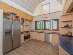  75-77 Tramican Street Point Lookout QLD 4183 $2,300,000 Both blocks are a total of 1,800m2 and have wonderful beach, bush and ocean views. The large architecturally designed house has a two car lock up garage at street level which links to the house with a timber walkway. The garage building has a large loft area - perfect for a craft room, office or even a separate studio bedroom and lockable storage areas underneath. The main house has two levels with all living areas on the top level.  There is a formal lounge area on entry, large open plan kitchen with walk in pantry plus formal dining - all opening onto a covered deck. There are two bedrooms and a bathroom on this level also.  The bottom level has three more bedrooms including the master bedroom with walk in robe and en suite bathroom, a second bedroom also has an en suite with spa bath and there is a small bunkroom The separate laundry with large storage area (perfect for a wine cellar) has direct access to the garden. 