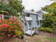 75-77 Tramican Street Point Lookout QLD 4183 $2,300,000 Both blocks are a total of 1,800m2 and have wonderful beach, bush and ocean views. The large architecturally designed house has a two car lock up garage at street level which links to the house with a timber walkway. The garage building has a large loft area - perfect for a craft room, office or even a separate studio bedroom and lockable storage areas underneath. The main house has two levels with all living areas on the top level.  There is a formal lounge area on entry, large open plan kitchen with walk in pantry plus formal dining - all opening onto a covered deck. There are two bedrooms and a bathroom on this level also.  The bottom level has three more bedrooms including the master bedroom with walk in robe and en suite bathroom, a second bedroom also has an en suite with spa bath and there is a small bunkroom The separate laundry with large storage area (perfect for a wine cellar) has direct access to the garden. 