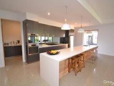  6 Durif Drive Moama NSW 2731 $695,000 Spacious Sophisticated Family Living Inspection Times: Sat 09/04/2016 09:30 AM to 10:30 AM Sun 10/04/2016 11:00 AM to 12:00 PM Situated on an approximate 1,000m2 allotment and less than 2 years old is this stunning five bedroom home. From the moment you open the front door you are graced with style and elegance.  The master bedroom includes a large walk in robe and ensuite with double vanity, waterfall shower and separate toilet.  The spacious spare bedrooms also have walk in robes and ceiling fans and the fifth bedroom located at the front of the home can be utilised as a home office with a hidden desk in the large built in robe.  The main bathroom features a bath and waterfall shower as well as a separate powder room.  The polished concrete floors feature hydronic floor heating and lead you through to the large open plan kitchen featuring a large breakfast bar with stone bench tops, stainless steel appliances including dual ovens and butlers pantry.  The open plan dining and living areas all feature floor to ceiling windows and push back glass sliding doors to the large undercover entertaining area with automatic blinds, open fire and ceiling fans and is surrounded by landscaped gardens which are equipped with a full automatic sprinkler system.  The home also features a large laundry, drying closest, plenty of additional storage space, ducted evaporative cooling and ducted vacuum.  The four car garage has been built to fit large boats, caravans and 4WDs and has a separate toilet.  If you have been searching for your dream home then look no further. PROPERTY DETAILS $695,000 ID: 363901 Land Area: 1000 m² Building Area: 30 