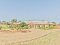  42 Gower Hardy Circuit Cowra NSW 2794 $529,000 Exclusive Family Home, Set on 1.5acres close to town * Set on an easy care, semi rural block, just on the outskirts of town, this home offers a rural setting with all local conveniences within minutes. * Privately nestled away in a cul-de-sac, the home captures elevated breezes and minimal neighbours, on a 6,334 m2 landscaped house block. * The driveway splits into two, with the main driveway leading to the home and returns around the water feature, while the second section of the driveway leads to the large lock up garages/workshop and boat or caravan parking pad. * The brick home has been built to a high standard, with intricate building angles, that separate the large separate living rooms. The main entry of the home is the central point, with feature tiled flooring and separates the master bedroom to the further three bedrooms. The master bedroom has a walk-in wardrobe and Tuscan feeling, modern ensuite. The bedroom also leads out to a private porch area. The further three more bedrooms all have built-in wardrobes, while two of these bedrooms have lovely bay windows.  * Spacious family and dining room, with a separate tiled, open plan living and meals room with the adjacent modern, eat-in kitchen with stainless steel appliances. This area opens out to a great, paved entertaining patio area, surrounded by lush gardens and opens to the child friendly lawns. * Modern family bathroom with separate toilet and third 'large' bathroom/ toilet basin. Walk-in linen room. * Large rumpus room, ideal as a kid's area and or home office, with separate entry.  Heating & Cooling * Underfloor heating & Ducted evaporative cooling, ceiling fans. Solar tinted windows on Western side of home Security * Back to base alarm system * Gardens and lawns have a fully automatic toro sprinkler system. * Large 10m x 11m three bay shed, two open bays, with high clearance, one lock up bay with mezzanine level storage, concrete floor and a sep concrete bay for boat or caravan parking.  TANK 18,000ltr or 4,500gallons 2002 built home 30 Squares under roof total 29 Squares living space Land size: 1.5acres approx Land rates: $993.34per year Currently rented until the 3rd of March 2016.  For more information or to arrnage a viewing of this property please contact Adam Gambrill on image: chrome-extension://lifbcibllhkdhoafpjfnlhfpfgnpldfl/call_skype_logo.png0437 007 303 or email on agambrill.cowra@ljh.com.au.   Property Snapshot  Property Type: House Construction: Brick Zoning: Residential Small 1(c) House Size: 30.00 m2 Land Area: 6,334 m2 Features: Built-In-Robes Close to schools Close to Transport Dishwasher Ensuite Established Gardens Family Room Fenced Yard Garden Shed Open Living Outdoor Living Pergola Septic System Storage Town Water Views Workshop 