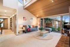  1 Hollyoak Rise Eltham North VIC 3095 $920,000 - $990,000  Exquisite Englehart design This feature-packed family Englehart home on 1300m2 could be just what you've been searching for, boasting beautiful high ceilings, quality finishes and a practical floor plan that ensures complete family comfort. The vast 2-storey interior includes a spacious kitchen/meals/living zone with granite benchtops, quality stainless steel appliances big island bench, stunning lounge with open fireplace and clerestory window, rumpus/billiard room for family fun, and a flexible TV retreat/family with open study. The master bedroom enjoys a robed dressing area and spa ensuite, while the huge 2nd bedroom can convert into two separate bedrooms. Upstairs delivers a sensational independent space with bedroom, walk-in robe, sleek ensuite and balcony with treetop views. A bright family bathroom and big practical laundry complete the interior. Outside, a wonderful alfresco zone is home to a swim-spa, pond and plenty of entertaining space, leading to pretty rear gardens. Quality extras include ducted heating, refrigerative cooling, air conditioning, ducted vacuum, security system, 3-phase power, 5000l water tank, double garage, 2-way driveway and good off-street parking. This first class home is positioned in a quiet neighbourhood within Eltham North Primary School zone and close to shops, schools, bus and parklands. Don't delay - this is it! Features Balcony Ducted Heating Built-In Robes Rumpus Room Vacuum System Study Alarm System Open Fire Place 