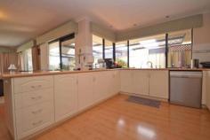  14 Rees Pl Wannanup WA 6210 $600,000 5 X 2 DOUBLE STORY LUXURY & 500meters from Bouvard Cut. Webb & Brown-Neaves luxury home built in 2005. Great street appeal with light brick is matched with a great portico entry with balcony. Walk in to enjoy the front lounge/sunroom. Enter the spacious family dining area with recessed ceiling and modern dimmer enabled lighting. All serviced by a well appointed kitchen with large bench top, gas hot plates, wall oven,microwave recess and corner pantry. The main double garage with electronic double door has shelving surround and home entry all under main roof. Four downstairs bedrooms have well designed central laundry, toilet and bathroom utilities.Currently the fourth room is a study-the choices are yours! The upstairs luxury master bedroom has a large en-suite, walk in robe and activity room with access to the balcony. This home also has reticulated lawn rear garden area and garden shed. The side access roadway allows a car to travel to the rear of the property to a large 12m X 5m garage which may be utilized as a workshop or function of your choice. Weekday viewings available by appointment. Other features: Built-In Wardrobes,Close to Schools,Close to Shops,Close to Transport,Garden Property Details Elders Property ID: 9752853 5 bedrooms 2 bathrooms 6 car parks Land Area 733 square metres Car Parks: 4 Double garage Air Conditioning 