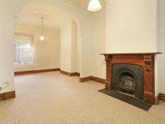  89 Swanston St Geelong VIC 3220 $490,000 Bluestone Cottage If you're after a prime piece of real estate in an unbelievably convenient location this charming Bluestone Cottage should be at the top of your list. From the moment you walk in the door you will be greeted with stunning traditional period features, such as high ceilings with ornate ceiling roses, sash windows and a cast iron fireplace. A central hallway separates the two bedrooms, both of which feature built in robes. This hallway then leads you to the formal lounge with an open fire place, dining or third bedroom. Further down the hall, you step down into the meals area & kitchen with a glass atrium - filling the rooms with light. The split system air conditioning & gas wall furnace will keep the house temperate, no matter what season. French doors lead out to the brick paved courtyard with a cottage garden. This period home has rear lane access to a remote controlled carport and small garage or extra storage space. Conveniently located to public transport and walking distance to Geelong CBD, this one not to miss out on.   Property Snapshot  Property Type: House Construction: Bluestone Land Area: 356 m2 Features: 10ft+ Ceilings Air Conditioning Built in Robes Close to Schools Close to Shops Close to Transport Courtyard Fireplace Formal Dining Room Formal Lounge Fully Fenced Yard Gas Gas Wall Heater Lounge Outdoor Living Storage Sunroom Verandah Workshop 