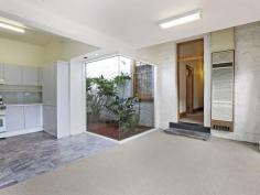  89 Swanston St Geelong VIC 3220 $490,000 Bluestone Cottage If you're after a prime piece of real estate in an unbelievably convenient location this charming Bluestone Cottage should be at the top of your list. From the moment you walk in the door you will be greeted with stunning traditional period features, such as high ceilings with ornate ceiling roses, sash windows and a cast iron fireplace. A central hallway separates the two bedrooms, both of which feature built in robes. This hallway then leads you to the formal lounge with an open fire place, dining or third bedroom. Further down the hall, you step down into the meals area & kitchen with a glass atrium - filling the rooms with light. The split system air conditioning & gas wall furnace will keep the house temperate, no matter what season. French doors lead out to the brick paved courtyard with a cottage garden. This period home has rear lane access to a remote controlled carport and small garage or extra storage space. Conveniently located to public transport and walking distance to Geelong CBD, this one not to miss out on.   Property Snapshot  Property Type: House Construction: Bluestone Land Area: 356 m2 Features: 10ft+ Ceilings Air Conditioning Built in Robes Close to Schools Close to Shops Close to Transport Courtyard Fireplace Formal Dining Room Formal Lounge Fully Fenced Yard Gas Gas Wall Heater Lounge Outdoor Living Storage Sunroom Verandah Workshop 
