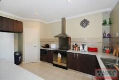  6 Corine Way Bayonet Head WA 6330 $525,000 UNIQUE HOME, GREAT LOCATION - Spacious 4 X 2 bathroom plus study and sep lounge - Large open plan living/dining area w' Chef Kitchen - Outdoor dome patio and aggregate floor - Close to Flinders Park Primary School, and Bayonet Head Shopping Centre  This spacious uniquely designed 2006 brick veneer home located on a quiet street in ever popular Bayonet Head. With side gate access to very private back yard, where you will find a dome patio with aggregate flooring all on a flat 719m2 block. The front of the house has fantastic road appeal with feature columns and an entrance pathway. Upon entering the home you will find the master bedroom to your right with large WIR housing plenty of shelving and hanging space, ensuite with a separate toilet. Off to the left is a separate lounge for those home movie nights the whole family can enjoy then further down the hall is a large study or a 5th bedroom. Follow the hallway through to a very spacious well-appointed open plan kitchen, dining and lounge. The chef's kitchen has a built in pantry feature bench divider and plenty of cupboard space, high ceilings, wood floor look vinyl throughout living and hallways. Dining is exceptionally large currently holding a 10 seater dining table with a reverse cycle air conditioner to heat and cool the dining/lounge area. Off the dining room down a small hallway is the other 3 bedrooms with double mirror sliding door BIR's, main bathroom with shower and bath and a separate room with vanity and floor to ceiling mirror, laundry with separate toilet. Located only a short drive to Flinders Park Primary School, new Bayonet Head shopping centre, local pharmacy and parks this fabulous family home won't last long call Kathleen Mier today on 0439 421 059. 