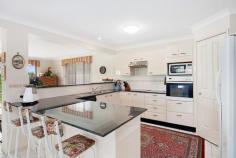  7 Kona Cres Bonnells Bay NSW 2264 STUNNING FAMILY HOME IN BONNELLS BAY This first class property is beautifully presented inside and out and represents excellent value for buyers looking for a large home in the prestigious 'Bonnells Bay Estate' and within a short walking distance to beautiful Lake Macquarie waterfront, The Bay Shopping Complex, Coles Supermarket, Cafes/Restaurants and quality schools.  - Outstanding Master Built home spanning over 2 levels with waterviews.  - Features 4 good sized bedrooms all with built-in wardrobes and ceiling fans.  - King sized master suite with large ensuite, walk-in wardrobe and new carpets.  - Formal lounge room with air-conditioning and formal dining room.  - Stunning gourmet kitchen with granite bench tops, dishwasher, induction glass cook top  and wall oven.  - Spacious family room with combustion wood heater and air-conditioning.  - Gorgeous main bathroom with separate toilet.  - Powder room, sitting room, hobby/craft room and walk-in pantry room.  - In-addition: carpets, light fittings, vertical blinds throughout the home.  - Sparkling inground salt water pool with solar heating, pool cover and outdoor covered  entertainment area. - Double lock-up garage with automatic remote door opener and internal access.  - 6m x 6m shed, 2 x water tanks, wood shed, established gardens and vegetable patch.  - Prime parcel of land approx 1,020m2 with adjoining council reserve giving direct access  through double gates into a fully fenced backyard ideal for boats, caravans and trailers.  This gorgeous home enjoys peace, privacy and a generous floor plan. Located in a much sought after area of 'Bonnells Bay' and surrounded by premium properties. This impeccable property will tick all the boxes for families. I suggest you take a look this could be the ONE!! Ring Leanne for your personal viewing today!!   Property Snapshot  Property Type: House Land Area: 1,020 m2 