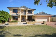  14 Rees Pl Wannanup WA 6210 $600,000 5 X 2 DOUBLE STORY LUXURY & 500meters from Bouvard Cut. Webb & Brown-Neaves luxury home built in 2005. Great street appeal with light brick is matched with a great portico entry with balcony. Walk in to enjoy the front lounge/sunroom. Enter the spacious family dining area with recessed ceiling and modern dimmer enabled lighting. All serviced by a well appointed kitchen with large bench top, gas hot plates, wall oven,microwave recess and corner pantry. The main double garage with electronic double door has shelving surround and home entry all under main roof. Four downstairs bedrooms have well designed central laundry, toilet and bathroom utilities.Currently the fourth room is a study-the choices are yours! The upstairs luxury master bedroom has a large en-suite, walk in robe and activity room with access to the balcony. This home also has reticulated lawn rear garden area and garden shed. The side access roadway allows a car to travel to the rear of the property to a large 12m X 5m garage which may be utilized as a workshop or function of your choice. Weekday viewings available by appointment. Other features: Built-In Wardrobes,Close to Schools,Close to Shops,Close to Transport,Garden Property Details Elders Property ID: 9752853 5 bedrooms 2 bathrooms 6 car parks Land Area 733 square metres Car Parks: 4 Double garage Air Conditioning 