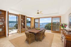  1802 Pittwater Rd Bayview NSW 2104 $7,500,000 A flawless absolute waterfront set on 1,130sqm 'Semloh' boasts a coveted northerly aspect and timeless architectural design by the renowned Walter Barda. This exquisite masterpiece represents the very best that the area has to offer, with direct Pittwater views captured from virtually every room and only 45 minutes to Sydney CBD. One of the few Bayview properties providing significant water depth at all tides, its impressive range of facilities can accommodate a large boat of up to 50 feet. There's a 107sqm jetty plus a slipway, fully equipped boatshed and a private sandy beach. Vast interiors are warm and inviting with abundant natural light. They include formal and informal living and dining areas, a billiard/a/v room, study and a self-contained lower level with a bar, wine cellar and a sauna. The property displays extensive use of bespoke timber throughout, while the floors are an attractive blend of Italian limestone and recycled blackbutt. Entertaining spaces comprise a gas heated salt water pool and spa, large deck, Tuscan inspired courtyard and a terrace. Four bedrooms have ensuites and the lengthy gourmet kitchen offers St George/Miele fixtures plus a walk through pantry. Other features include two gas fireplaces, alarm, air conditioning, ducted vacuuming, plantation shutters and a four car garage. Enjoying an immensely tranquil setting with direct access to boating clubs, this enviably private double brick home is simply extraordinary.   Property Snapshot  Property Type: House Land Area: 1,130 m2 Features: Air Conditioning 