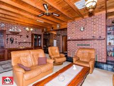  15 Mulberry Tree Cl Swan View WA 6056 $600,000's  Built in 1988 to the owner's brief, this solid brick and iron home is meticulously presented and will suit those buyers looking for something unique but still offering the opportunity to put in their personal touches should you wish. The home features an entry hall and opens out to the lounge room with raked ceiling and an open fire, taking in outstanding views to the city, flow through to the open plan kitchen and meals with a wood burning stove. The kitchen has plenty of cupboards and features some stainless steel appliances. The four bedrooms are a good size with the master featuring a walk in robe and en-suite. Both bathrooms have been partly modernised. High ceilings feature throughout. For your creature comforts the property is cooled via reverse cycle air conditioning, has solar hot water and solar panels for the energy conscious plus security shutters to keep the property safe and cool. With wrap around verandahs outside, the manicured gardens have extensive moss stone retaining walls and a grassed area where you can lay back and watch the Australia Day fireworks. The gardens are automatically reticulated and features a huge granite out crop as you walk up to the freshwater below ground pool - ready and waiting to be enjoyed during our warm summers. A carport for two cars in tandem and a storage room under the main roof completes the picture along with additional parking in two areas. This property is located so close to the shops, yet you will feel you are miles away from it all. For a private viewing, please do not hesitate to call. For Sale $600,000's 1/2 Acre, City Views Features General Features Property Type: House Bedrooms: 4 Bathrooms: 2 Land Size: 1914 m2 (approx) Indoor Ensuite: 1 Toilets: 2 Built in Wardrobes Split system Air Conditioning Ducted Heating Ducted Cooling Reverse cycle Air Conditioning Air Conditioning Open Fireplace Outdoor Carport Spaces: 2 Swimming Pool - Inground Eco-friendly Solar Panels Solar Hot Water 