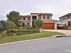  15 Baton Rouge Dr Mindarie WA 6030 $1,549,000 EXCLUSIVE DRESS CIRCLE ESTATE Immaculate & well presented Large Executive Home - packed with Features, a Pool and Ocean Views  * This beautiful dble storey quality Executive home is over 412 sqms of internal living with 4 good sized Bedrooms (Kingsize Master is upstairs with downstairs Guest Room), 3 quality high spec Bathrooms, separate Study, 4 separate spacious Living areas (downstairs Lounge/Theatre, open-plan Family, Games/Bar areas and Upstairs areas leading to Balcony with Ocean views), combined Meals/Dining area overlooked by spacious & modernly appointed Gourmet Kitchen, with deluxe Laundry (with plenty of storage) and much more.  * Inside main features include; grand tiled Entry to mainly tiled floors and quality carpeted to remaining areas including to stairs leading to the upper level & carpeted Bedrooms. Feature High Ceilings are to all Living areas t/out particularly above the Family with high Void to let in the natural light. Other features include; a sophisticated & wireless home smart Electronic Lighting and Security Alarm system - remotely controlled by your Iphone / Ipad - with ducted rev cycle A/C system, roof insulation, highest quality fixtures, fittings and window treatments t/out, skirting boards, steel balustrade staircase, including to the Kitchen complete with; all quality cooking appliances (Fisher Paykel dishwasher to stay), Granite stone / breakfast bar, classic Jarrah cabinets & doors, plenty of overhead & pantry cupboard space and more. All Bath/Powder rooms are adorned with quality plumbing fixtures & fittings & stone benches (incl floor-to-ceiling tiling to Master Ensuite). Additional features incl; dual gas storage HWS's, gas fireplaces to Dining & Master Bedroom, elegant wine cellar, glass tinted windows, bi-fold stacker doors to feature Games/Bar - Bar complete with Eco stone flooring, Granite benches, & Jarrah cabinetry, fridges and beer tap. The Theatre system is a highly sophisticated unit complete with; projector, fixed screen and cabinetry.  * Outside main features include; Appealing street front elevation with external render brickwork, easy care front & rear fully retic lawns and gardens (off a shared bore). Games room opens to a large sparkling concrete below ground fenced Pool. To the front is a double garage (with shoppers access, w/shop area & remote door) and with paver brick tiled driveway & footpaths t/out. In addition to the garage is a good sized boat/caravan parking bay for that 3rd vehicle/vessel. The magnificent Ocean views can be enjoyed from various vantage points around the home - particularly from upstairs West facing cedar lined approx 16 sqm Balcony / Master Bedroom & Study.  * All contained on a large 789 sqm block literally a short stroll down to Mindarie Marina, or 2-3 min drive to public & private Schools, Beaches, Parks, Ocean Keys Centre. The home compares to and is surrounded by some of Mindarie's finest homes and must be viewed to be fully appreciated, therefore ring Ray to view strictly by appt today.  PROPERTY DETAILS $1,549,000 FROM ID: 371399 Land Area: 789 m² 